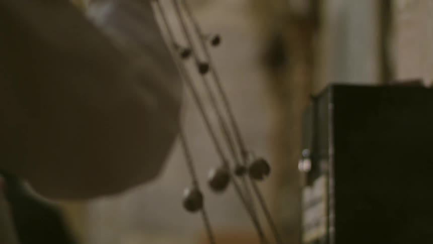 A man waves rosary beads