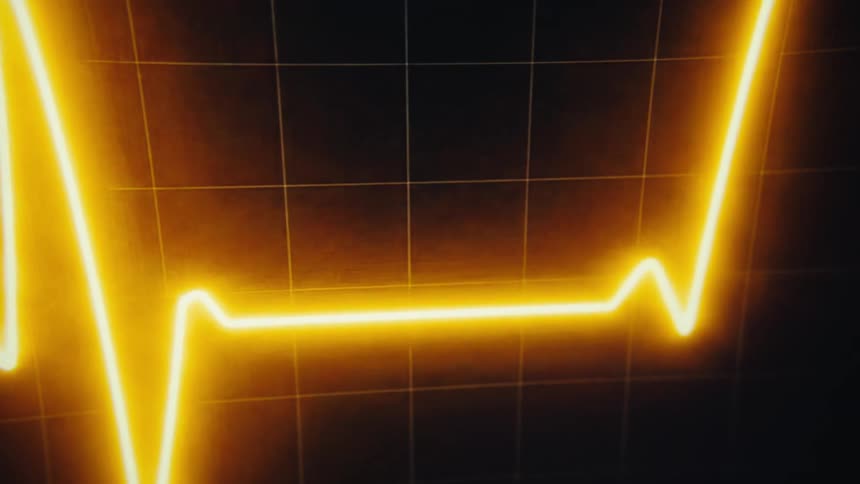 A vibrant glowing orange line graphs a rhythmic heartbeat across a dark gridded medical monitor