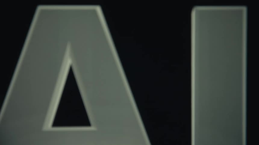 Bright light highlights the animated acronym ai