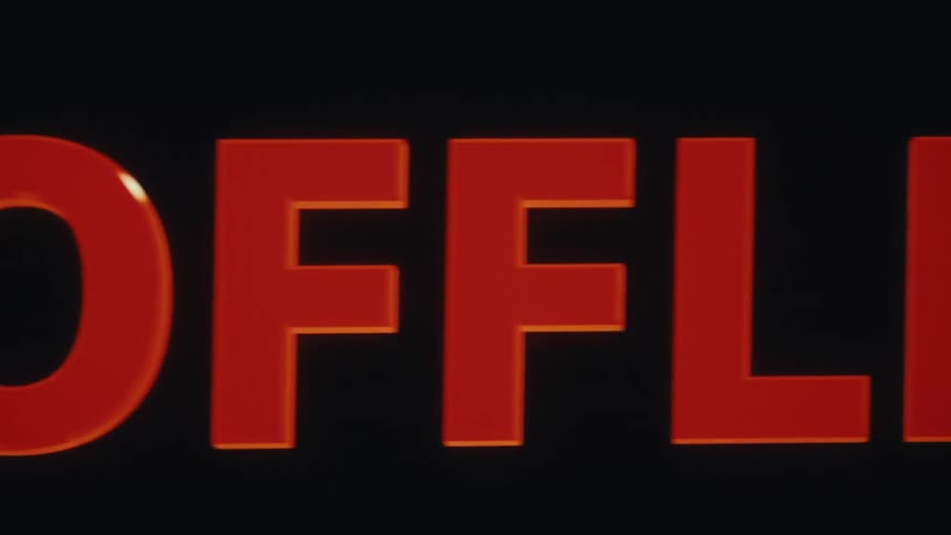 A video shows the word offline with orange letters sliding from left to right across a screen