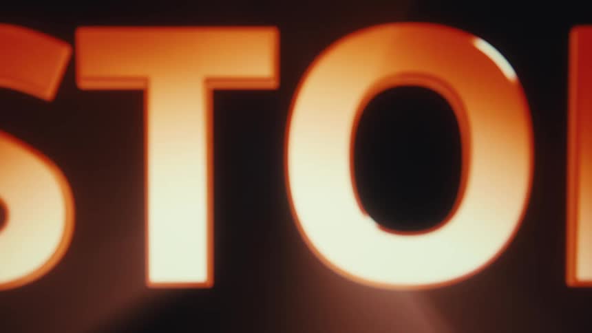 Word stop in red displayed against a black background