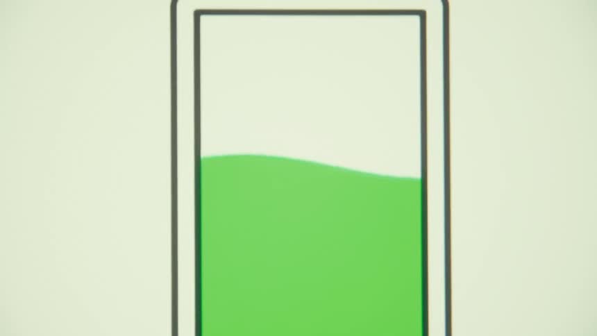 A digital graphic shows a battery icon with a green liquid charging up inside it filling the space before the entire image becomes blurred