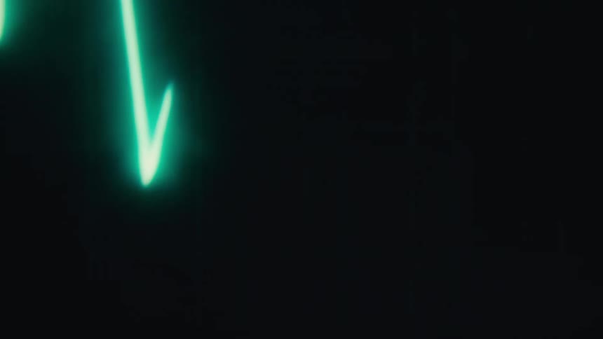 Close up of an electronic screen displaying electric heart waves in motion