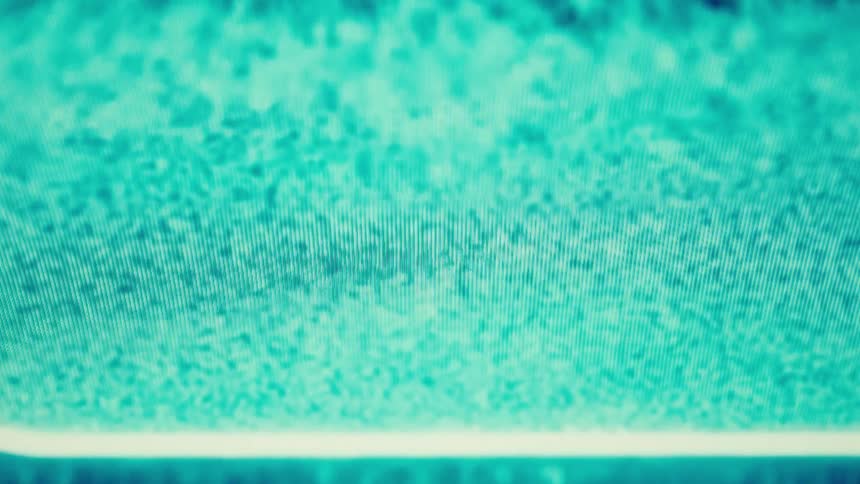 A closeup shot shows a horizontal beam of light expanding across a dark screen transforming into a digital cloud shape the cloud is filled with a blue and tealcolored static that flickers and pulses