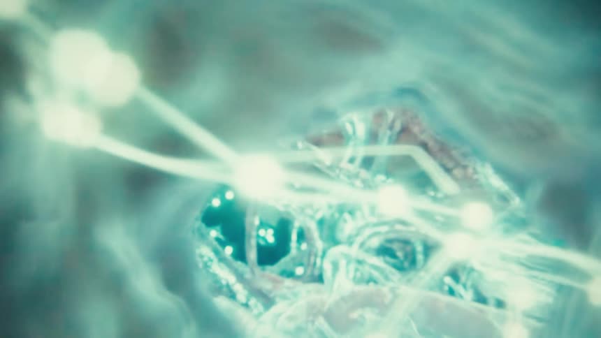A microscopic view shows glowing turquoise neural networks with bright nodes connecting to form a weblike pattern in a dark blue organic environment