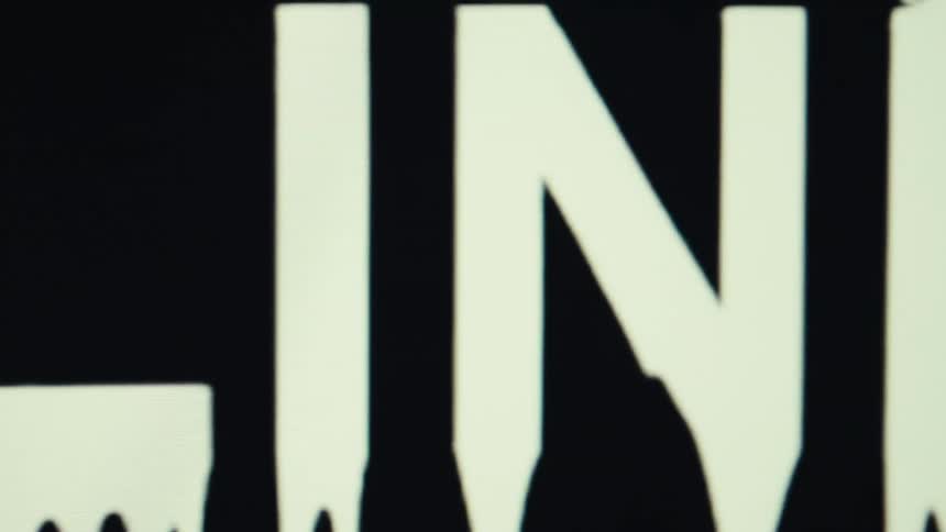 Bright sign displaying the word online in white against a black background