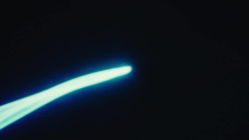 A screen shows a section of light that moves from blue to pink
