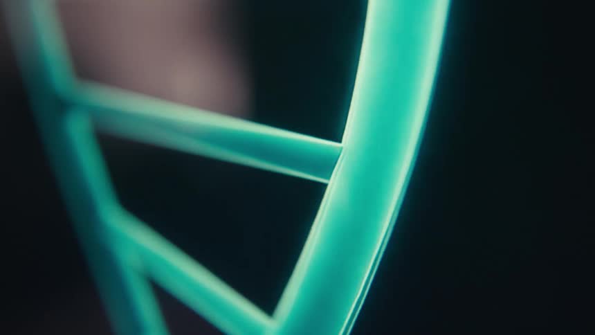 A dna strand is spinning on the monitor