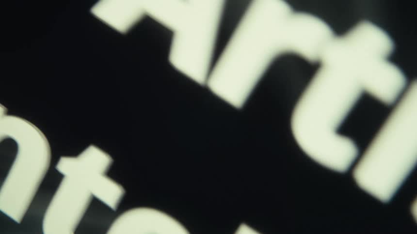 Artificial intelligence written in white letters on a dark background