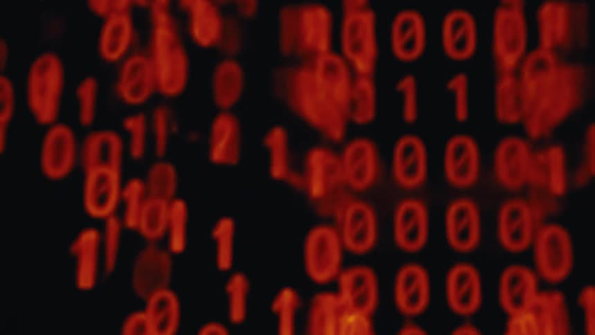 Sequence of red binary numbers appears in a digital pattern on a black background