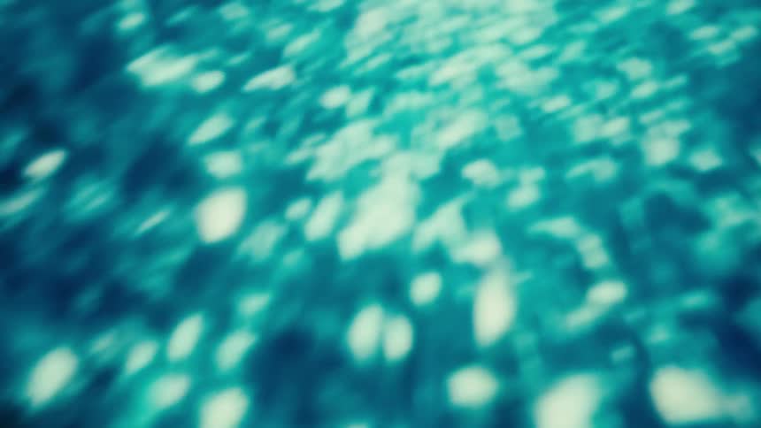 An abstract view of a liquid form with blue light moving chaotically