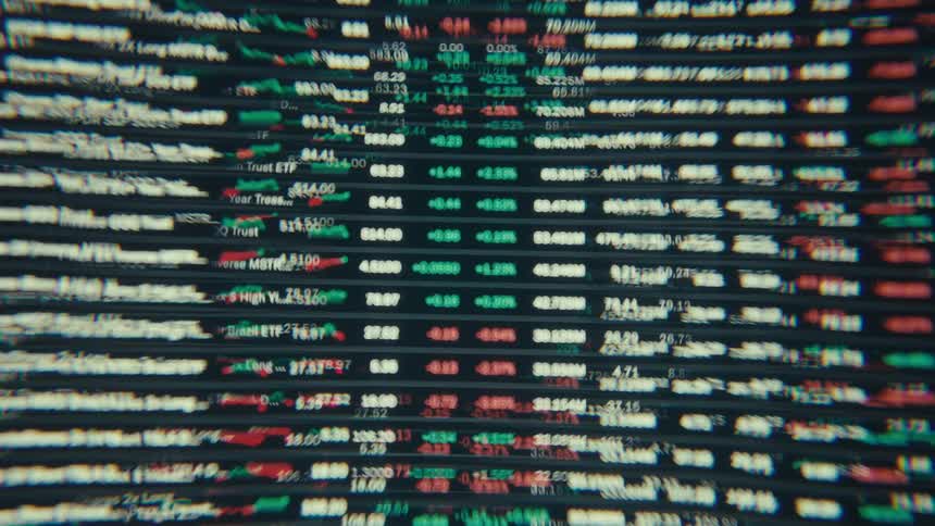 Closeup of a screen displaying distorted stock market data