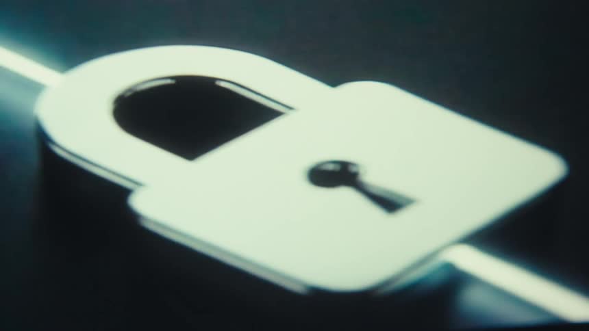 Silver metallic padlock highlighted against a dark background
