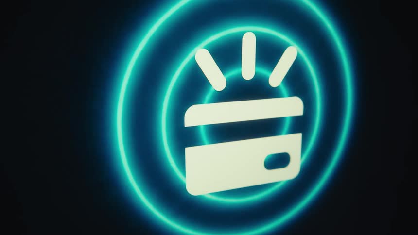 The first line of the video shows a static stylized image of a credit card glowing with three light rays emanating from it the second line shows a series of expanding blue circles radiating outwards from the credit card image