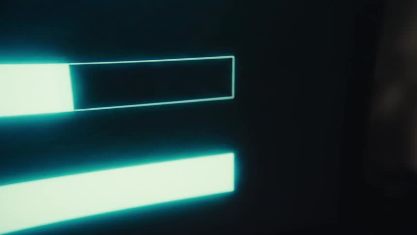 The bars on the computer screen fill with light