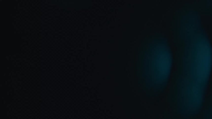Blue neon light waves forming curved overlapping patterns on a dark background