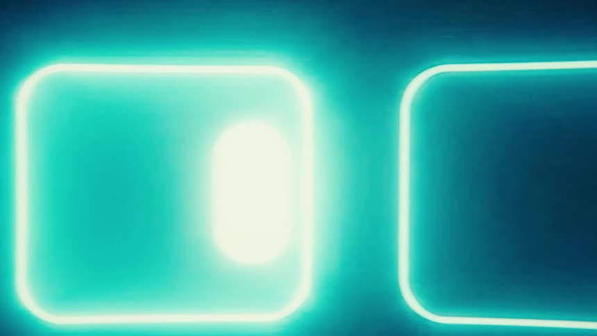 A brightly colored screensaver is moving on the monitor