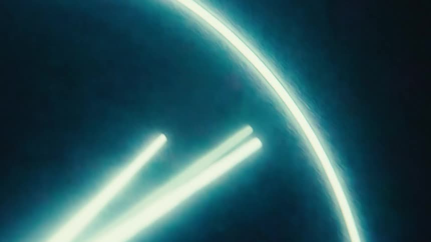 Blue neon light forming part of a circle with two bright vertical lines in the center