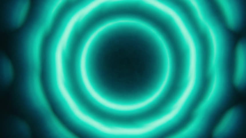 Closeup of glowing concentric neon circles in an abstract pattern