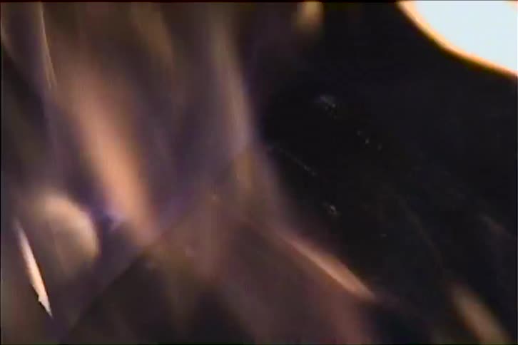 Flames in motion against a dark background