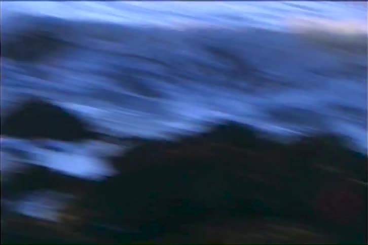 Rough waters crash on the shore line