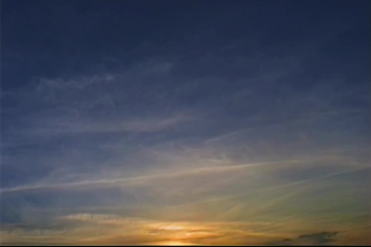 Sky at sunset with orange tones on the horizon and dark blue above