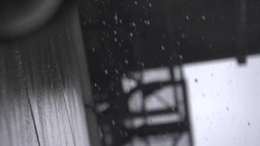 The water slowly drips from the building