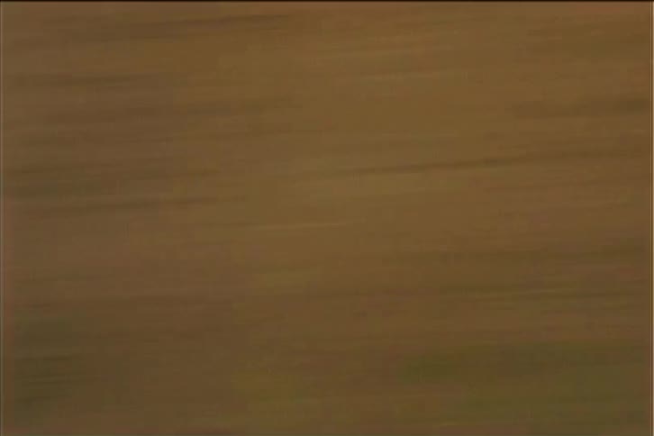 The screen starts with a fastmoving brown and orange horizontal streak like a car racing past a fence the scene then transitions to a dark blue color