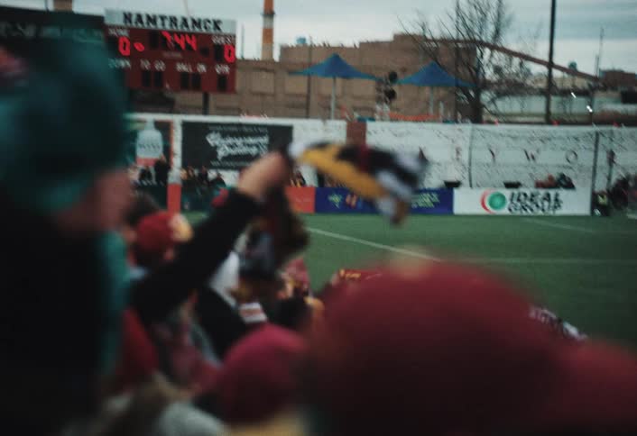 The fans are cheering at a soccer game