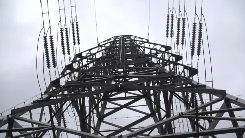 View from below of a very tall electric tower