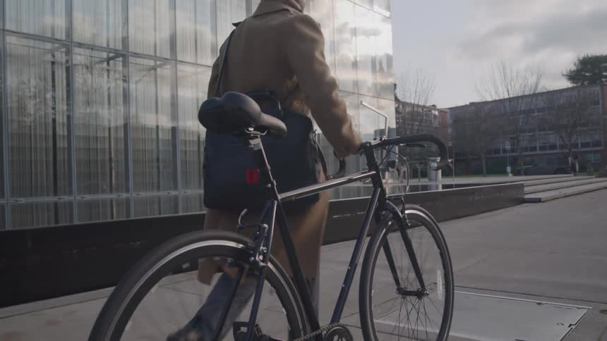 A man walking his bike