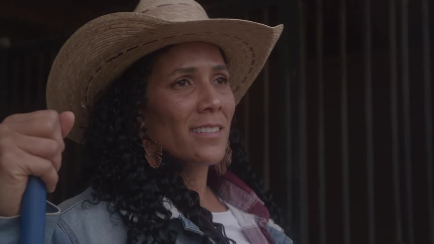A woman wearing a cowboy hat