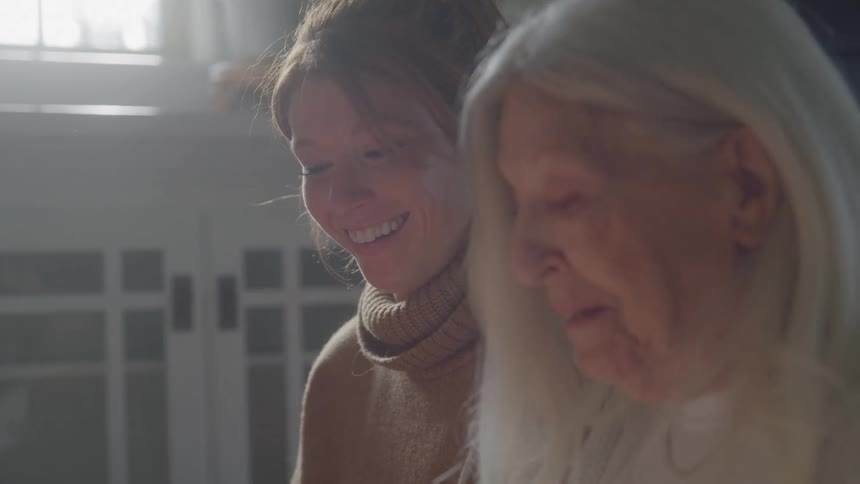 Quiet connection between generations in a moment of gentle light