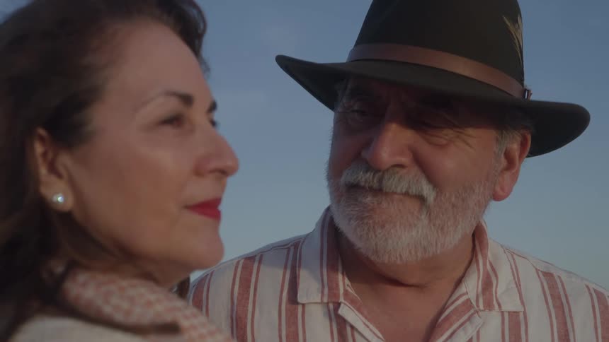 Mature couple shares a moment outdoors