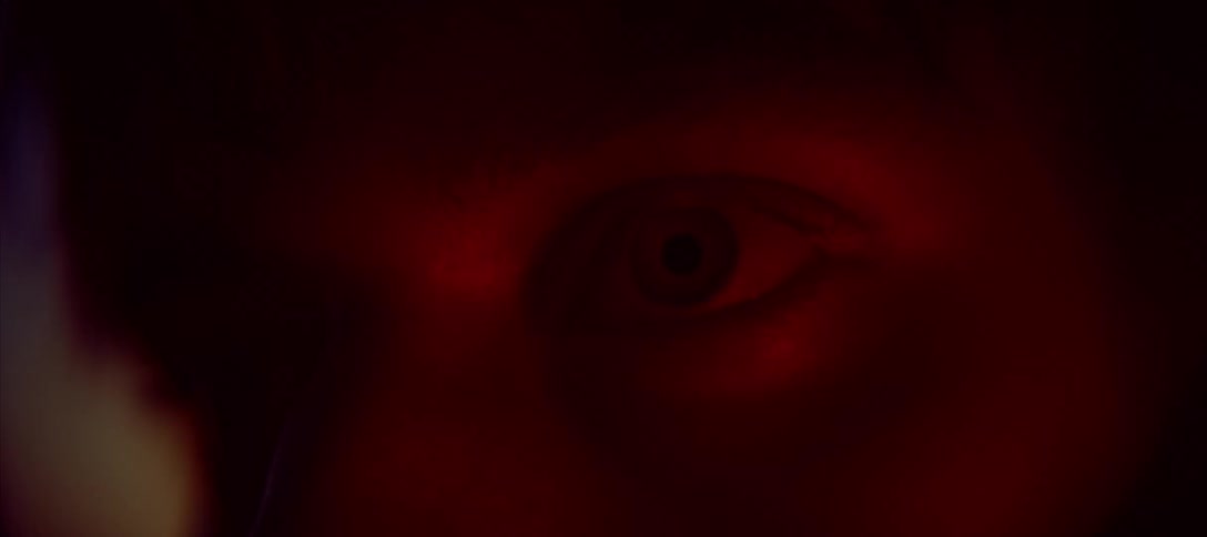 A persons eye is visible in a closeup shot as the light changes