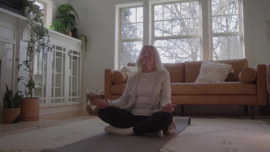 A woman sits and meditates