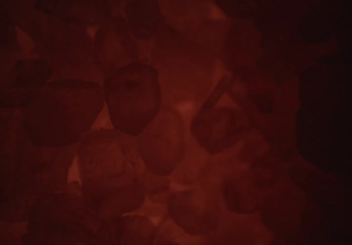 Red light on an abstract mineral