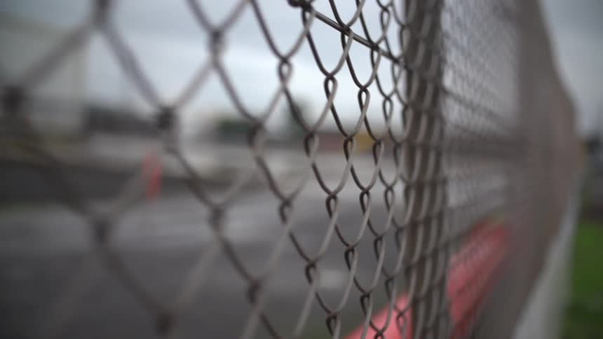 View of a chain link fence by a lot