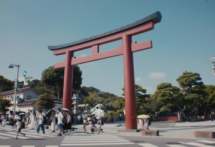 Tourists walk under the arch in town