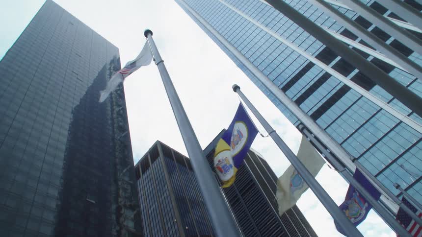 Wind blows the flags in front of the building