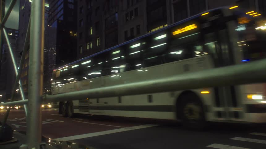 Traffic on a busy street and intersection in a metropolitan city at night