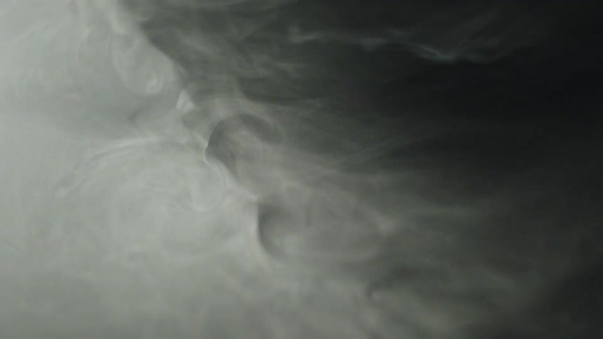 A nighttime storm churns the ocean water into rapid chaotic motion forming a series of powerful waves