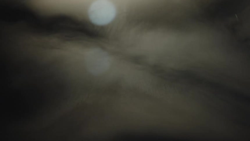 Closeup of an abstract texture with soft swirls of light