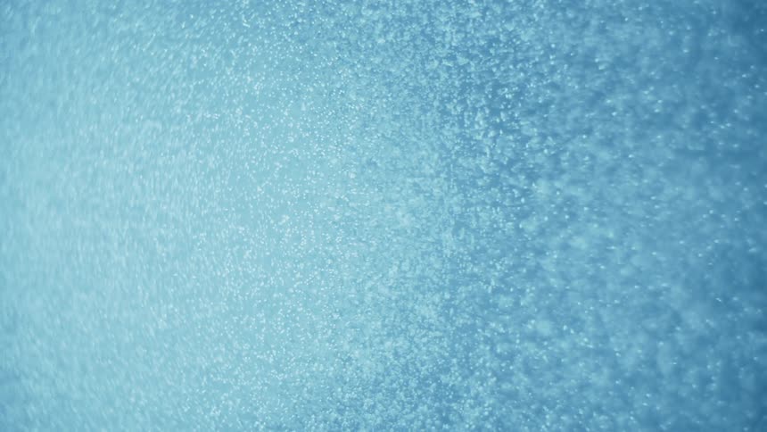 Underwater seafloor with a blue hue caused by sunlight reflection