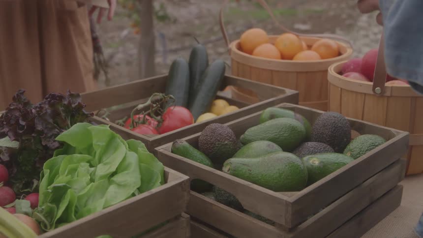 A person is selling produce at the market