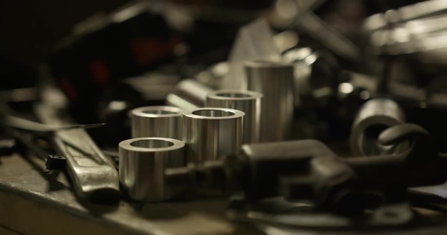 A messy workbench with various tools