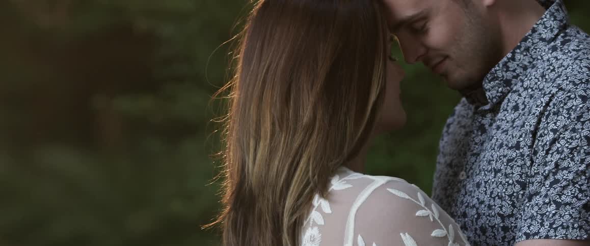 A man and woman lean together