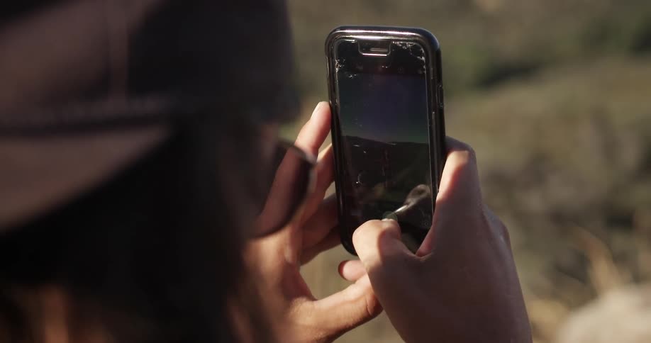 A person is taking a photograph with a phone