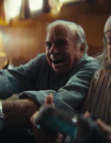 The man and woman have fun playing video games