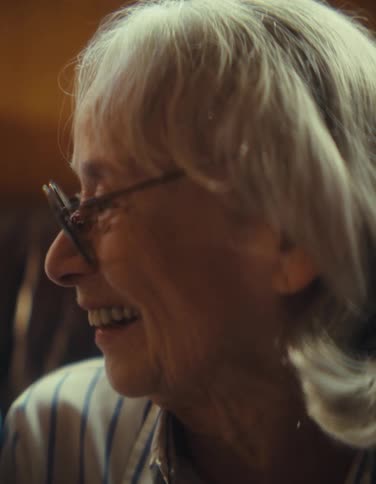 Closeup of an elderly couple laughing together indoors